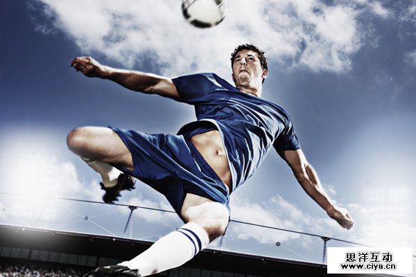 Soccer player kicking soccer ball